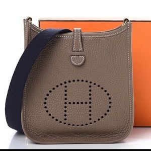 Hermès TPM Evelyn etoupe with navy straps .